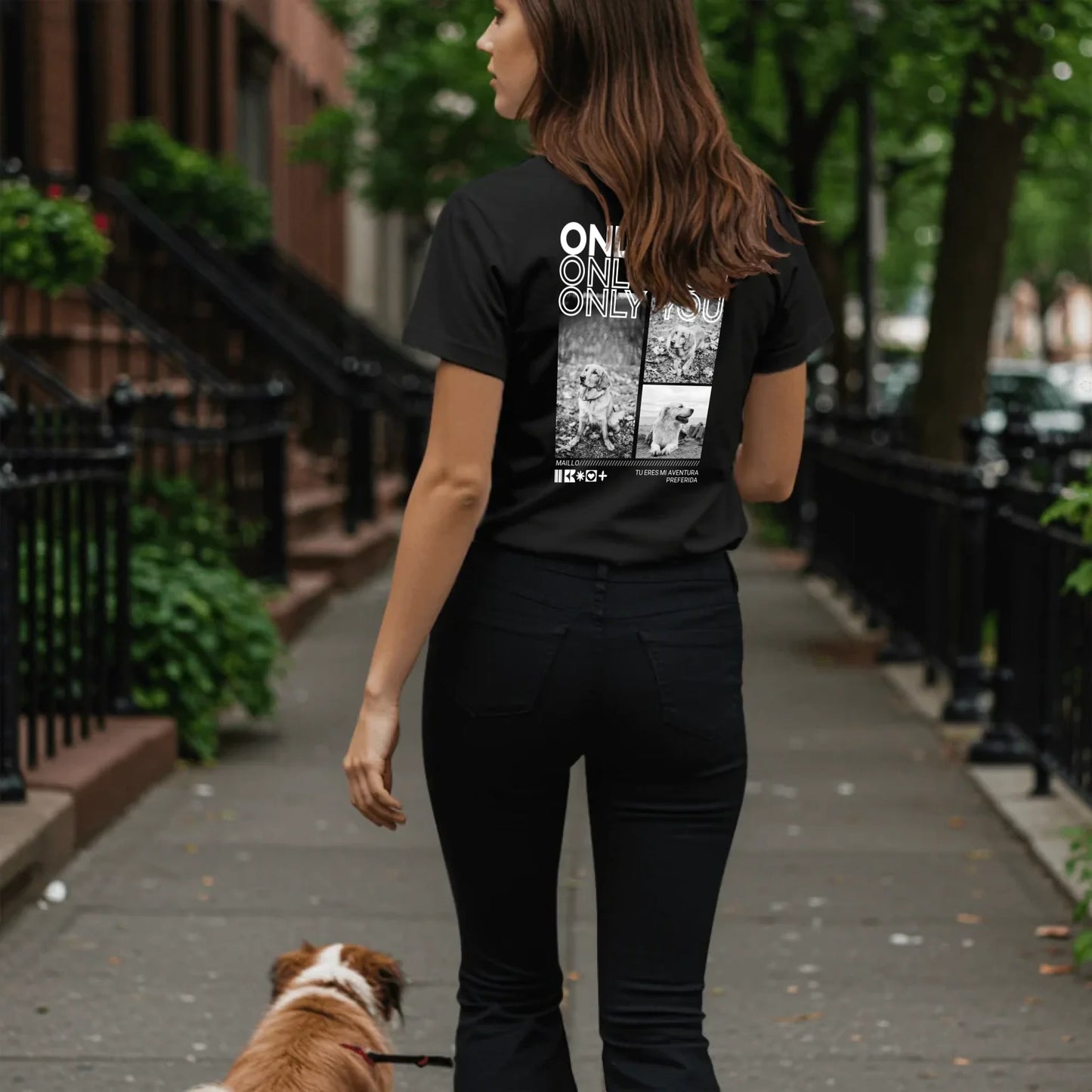 Woman walking dog on sidewalk - Black